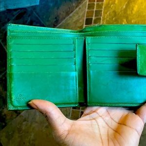 Well loved vintage green Gucci wallet